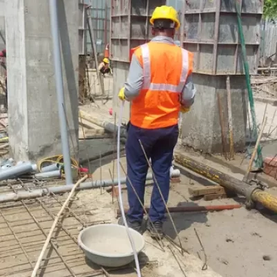 Post-construction termite drilling and injection treatment